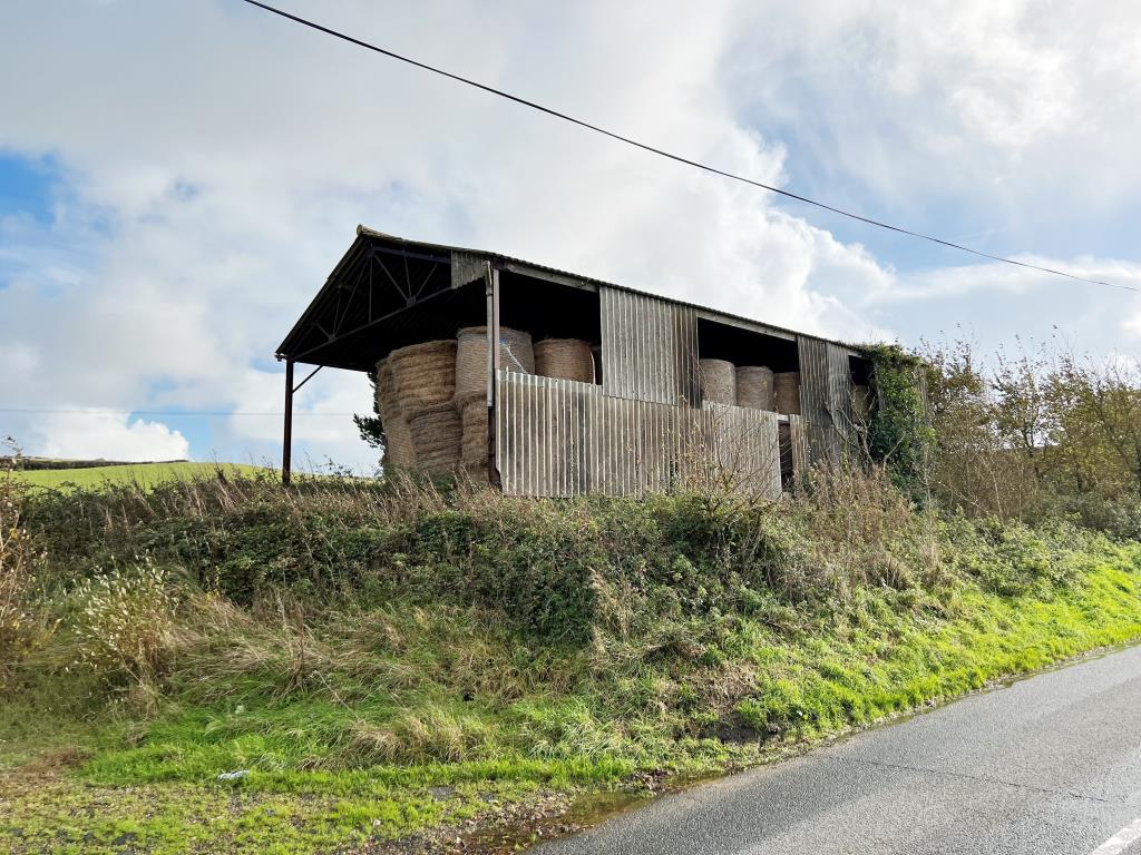 Lot: 133 - AGRICULTURAL BARN WITH POTENTIAL AND SEA VIEWS - Road Side View of Barn